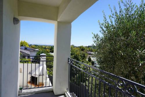 a balcony of a house with a view at Tuscan Villa with a View in Havelock North