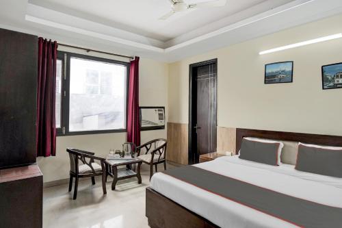 Postel nebo postele na pokoji v ubytování Hotel O Gurgaon 26