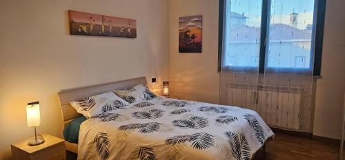 Postel nebo postele na pokoji v ubytování La chiocciola