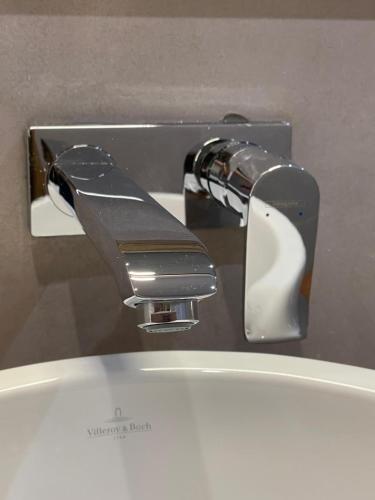 a close up of a toilet water faucet at Villa Vista in Toubab Dialaw