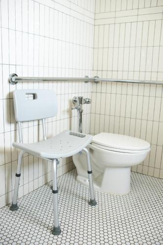 a bathroom with a toilet and a sink at Sound View Greenport in Greenport