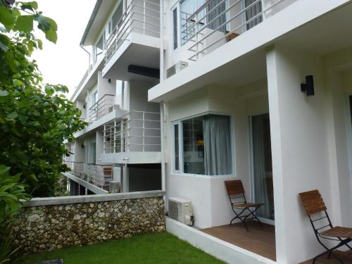 two chairs on the balcony of a building at Allia Residence in Nusa Dua