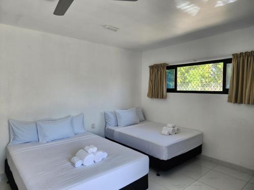 Una cama o camas en una habitación de Fugalei Motel