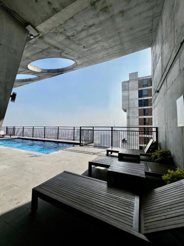 a patio with a view of the ocean from a building at Loft en el Centro de Monterrey, Hermosas vistas FIFA World Cup 2026 Fan Fest Lodging in Monterrey