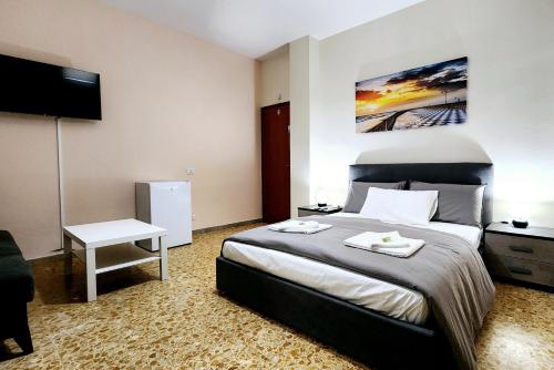 a hotel room with a bed and a television at Luna di Pisa in Pisa