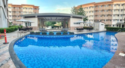Bazén v ubytování Suite Elite at Cheer Residences, Marilao, Bulacan nebo v jeho okolí