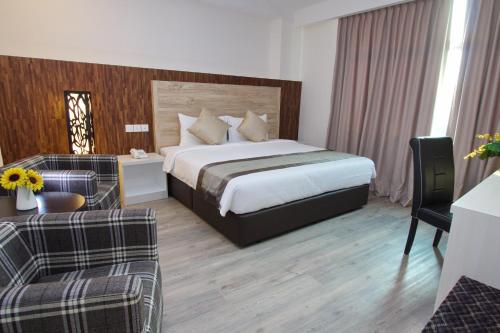 Postel nebo postele na pokoji v ubytování Molek Garden Hotel