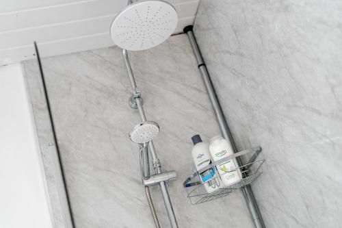 a shower in a bathroom with a shower at The Old Bike Shop Flat 2 in Heapey