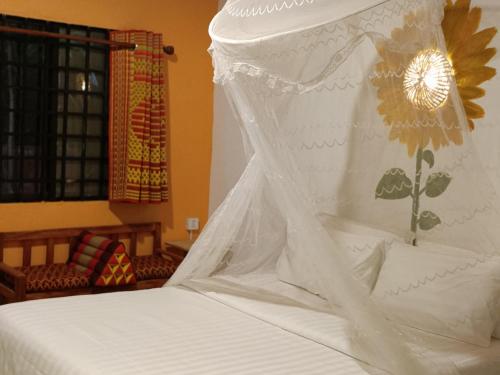 Ένα ή περισσότερα κρεβάτια σε δωμάτιο στο Siem Reap Homesteading II