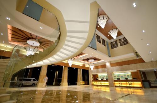 a lobby of a building with domed ceilings at Henann Resort Alona Beach in Panglao