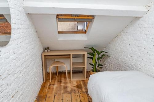 Ένα ή περισσότερα κρεβάτια σε δωμάτιο στο Cosy house with city garden near Antwerp-central