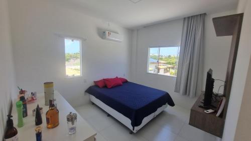 Postel nebo postele na pokoji v ubytování Casa maravilhosa no melhor local de Jacuipe, no encontro do rio com o mar