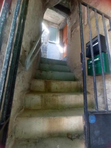 a stairway leading up to a room with a window at Petit Duplex Lumineux, hyper centre à 2 pas du port, Intendance Luxury Host in Cherbourg en Cotentin