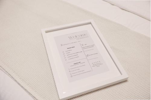 a picture of a document on a table at BOHO Loft - Augarten City Apartment, Terrace in Vienna