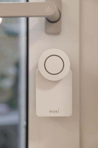 a button on a door with the word monk on it at BOHO Loft - Augarten City Apartment, Terrace in Vienna