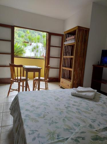 Postel nebo postele na pokoji v ubytování Suites Brilho do Sol