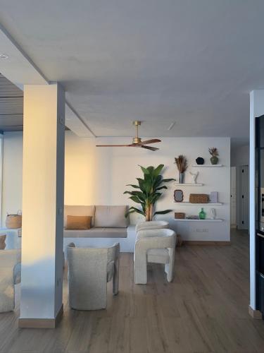 a living room with a couch and a table at Villa Olimonte in Valverde