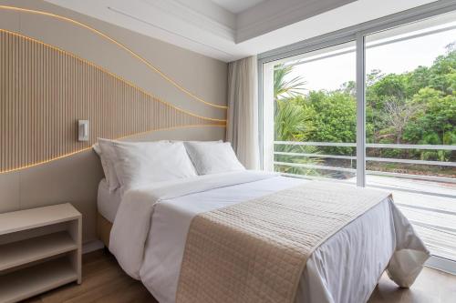 Postel nebo postele na pokoji v ubytování Rio Quente Resorts - Hotel Turismo
