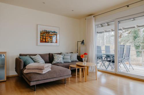 a living room with a couch and a table at Ferienhaus Hilde in Meersburg
