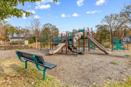 a park with a playground with a slide at London Towne Bungalow Wloft - Walk To The Beach! in Edgewater