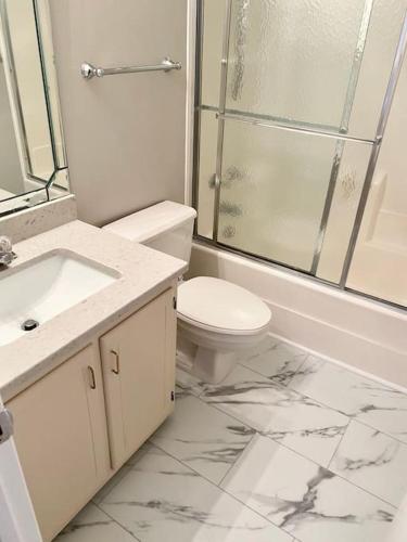 a bathroom with a toilet and a shower and a sink at Summer Bookings Available NOW! Going Fast! in Calabash