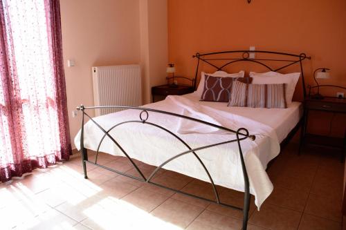 Кровать или кровати в номере Asterida Villas