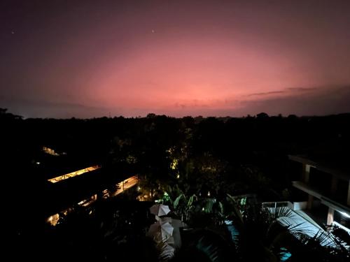 a sunset from the rooftop of a building at Brata Cottage Ubud in Ubud