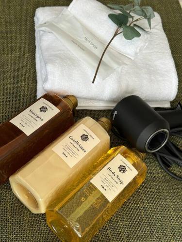 a pile of soap and other items on a table at Osaka KyoSai-A 栖晚 in Osaka