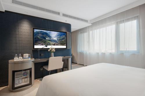 Кровать или кровати в номере Atour Light Hotel Chengdu Shuangliu Airport Jinhua Road