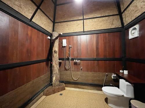 a bathroom with a shower and a toilet in it at River tales ริเวอร์เทลส์แก่งกระจาน in Phetchaburi