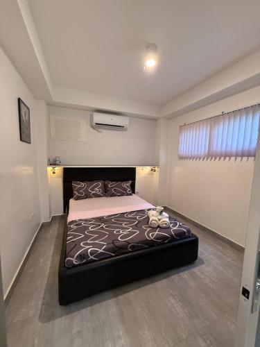 Cama o camas de una habitación en Logan Apartments
