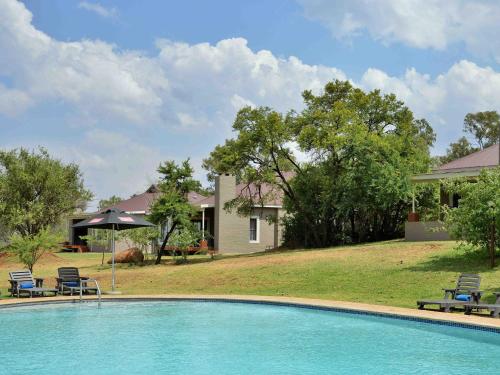 The swimming pool at or close to African Hills Safari Lodge & Spa