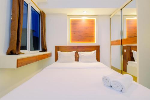 Ένα ή περισσότερα κρεβάτια σε δωμάτιο στο Comfortable and Good Studio Bogor Icon Apartment By Travelio