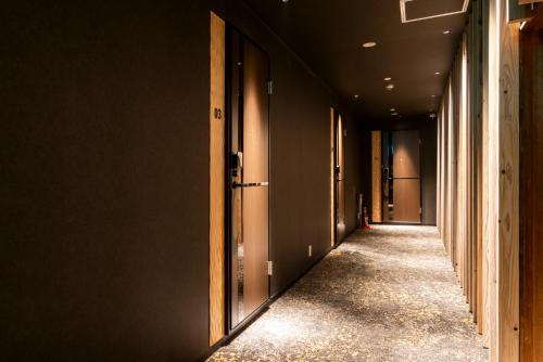 a hallway of an office building with a long corridor at 糸島 リゾート Tumugu in Fukuoka