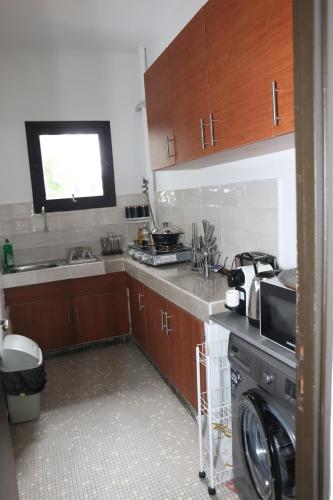 Η κουζίνα ή μικρή κουζίνα στο Living 1Bed colonial style in business district