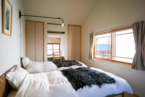 Postel nebo postele na pokoji v ubytování Une stay&diner