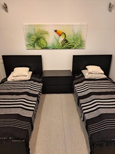 Katil atau katil-katil dalam bilik di Jaunāmuiža Apartamenti