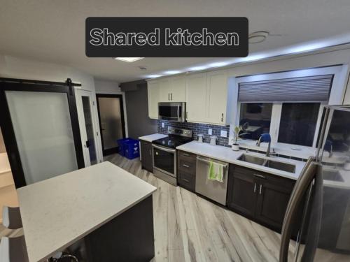 a kitchen with a sink and a counter top at Cozy 2 in Regina