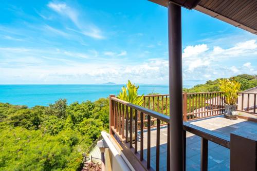 a balcony with a view of the ocean at Ocean Pearl Seaview Residence in Rawai Beach
