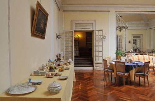 a living room with a table with dishes on it at Grande Albergo Quattro Stagioni in Rieti