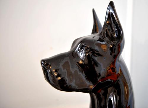 a black sculpture of a black dog statue at Grande Albergo Quattro Stagioni in Rieti