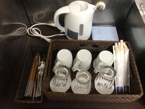a tray with cups and utensils on a table at Newly Reformed! Kawagoe Residence - 上福岡アーバンハイツ in Kamifukuoka