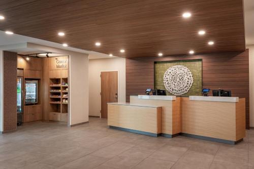 a lobby with a counter and a wine tasting room at Fairfield by Marriott Inn & Suites Omaha at MH Landing in Omaha