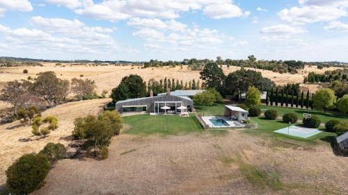 an aerial view of a home in a field at Fassway Farm in Edgecombe