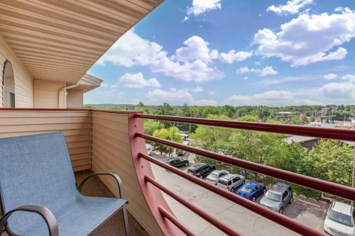 a balcony with a table and two cars on it at Atlantis Family Waterpark Hotel, an Ascend Collection Hotel in Wisconsin Dells