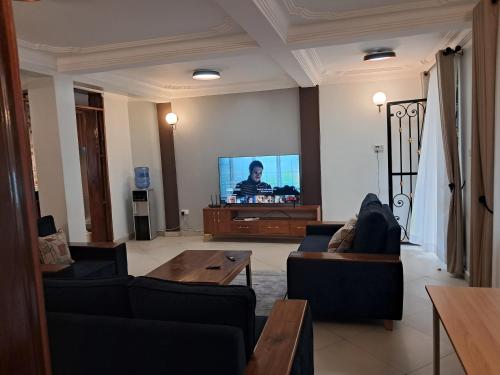 TV a/nebo společenská místnost v ubytování Elena & Kimberly