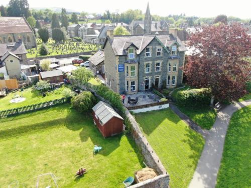 an aerial view of a large house with a yard at Bronwye in Builth Wells