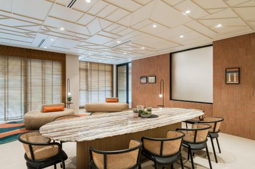 a large conference room with a large table and chairs at Citadines Tanjung Tokong Penang in George Town