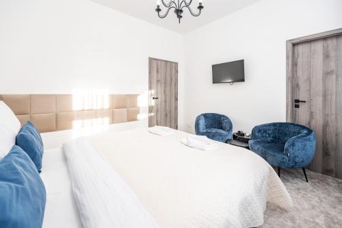 Postel nebo postele na pokoji v ubytování Hotel Litovel