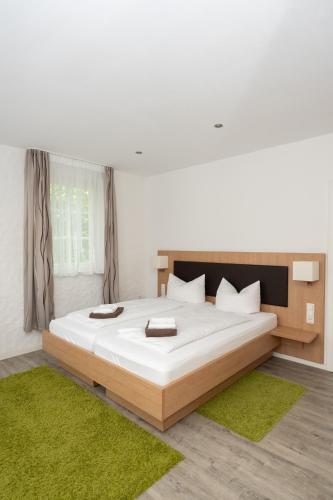 Ένα ή περισσότερα κρεβάτια σε δωμάτιο στο Hotel Garni BURG WALDENSTEIN